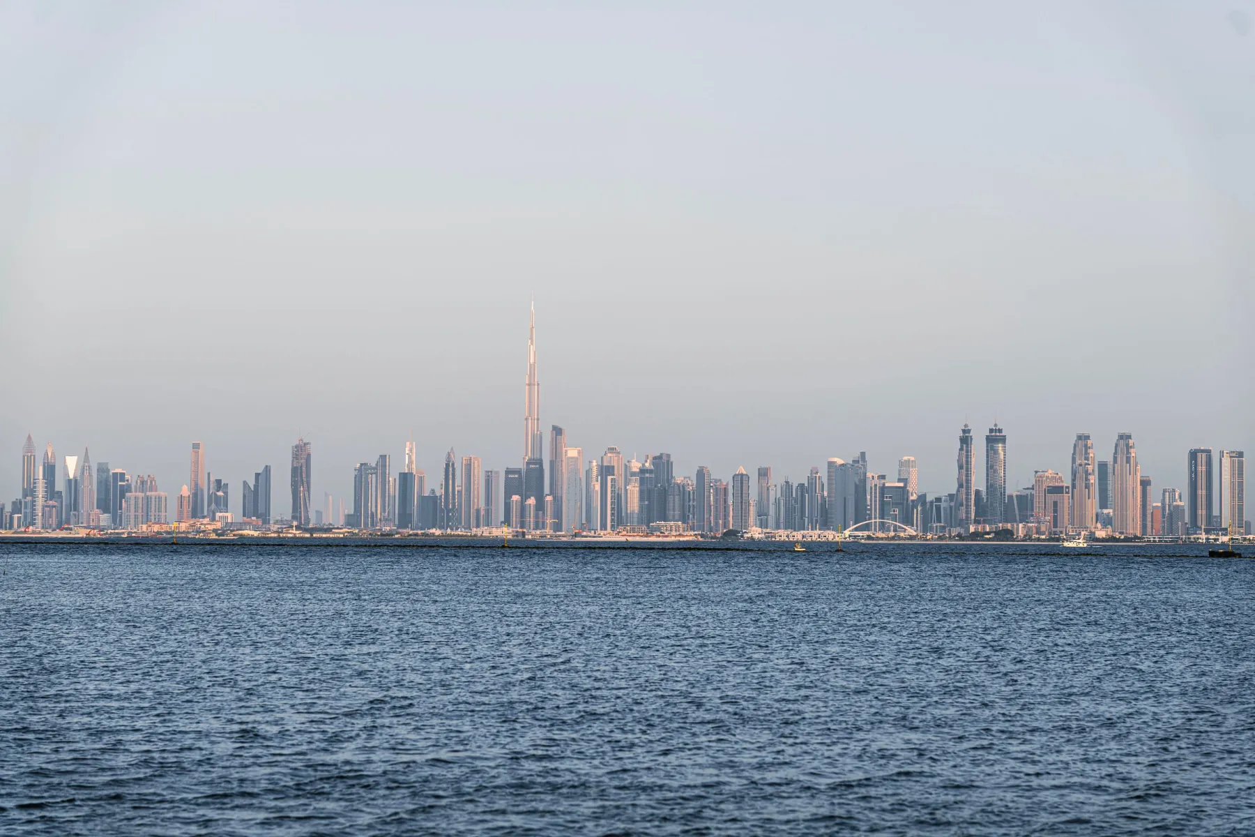 A stunning view of Dubai's skyline featuring Burj Khalifa across the sea.