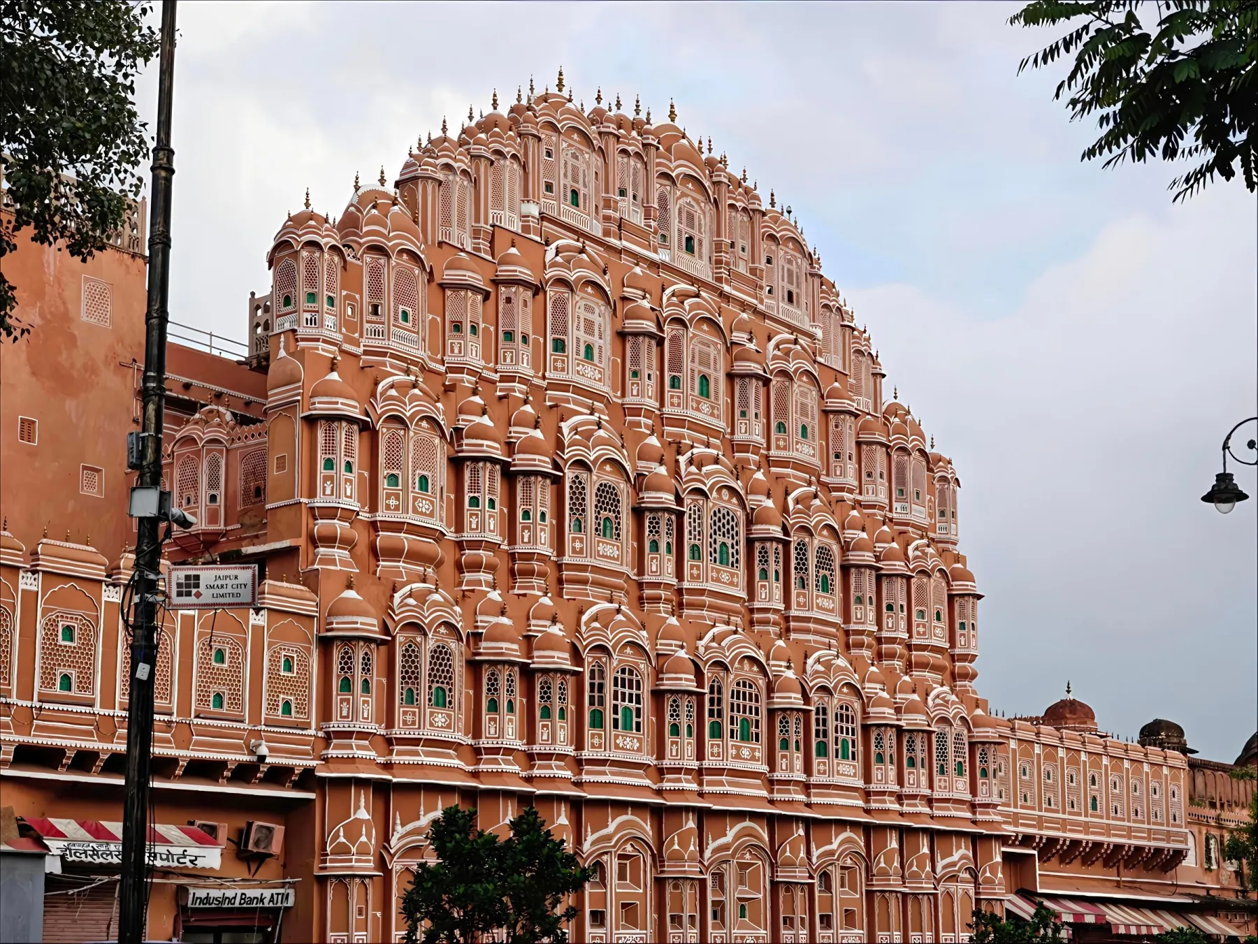 Stunning view of the historic Hawa Mahal, Jaipur showcasing intricate pink sandstone architecture.